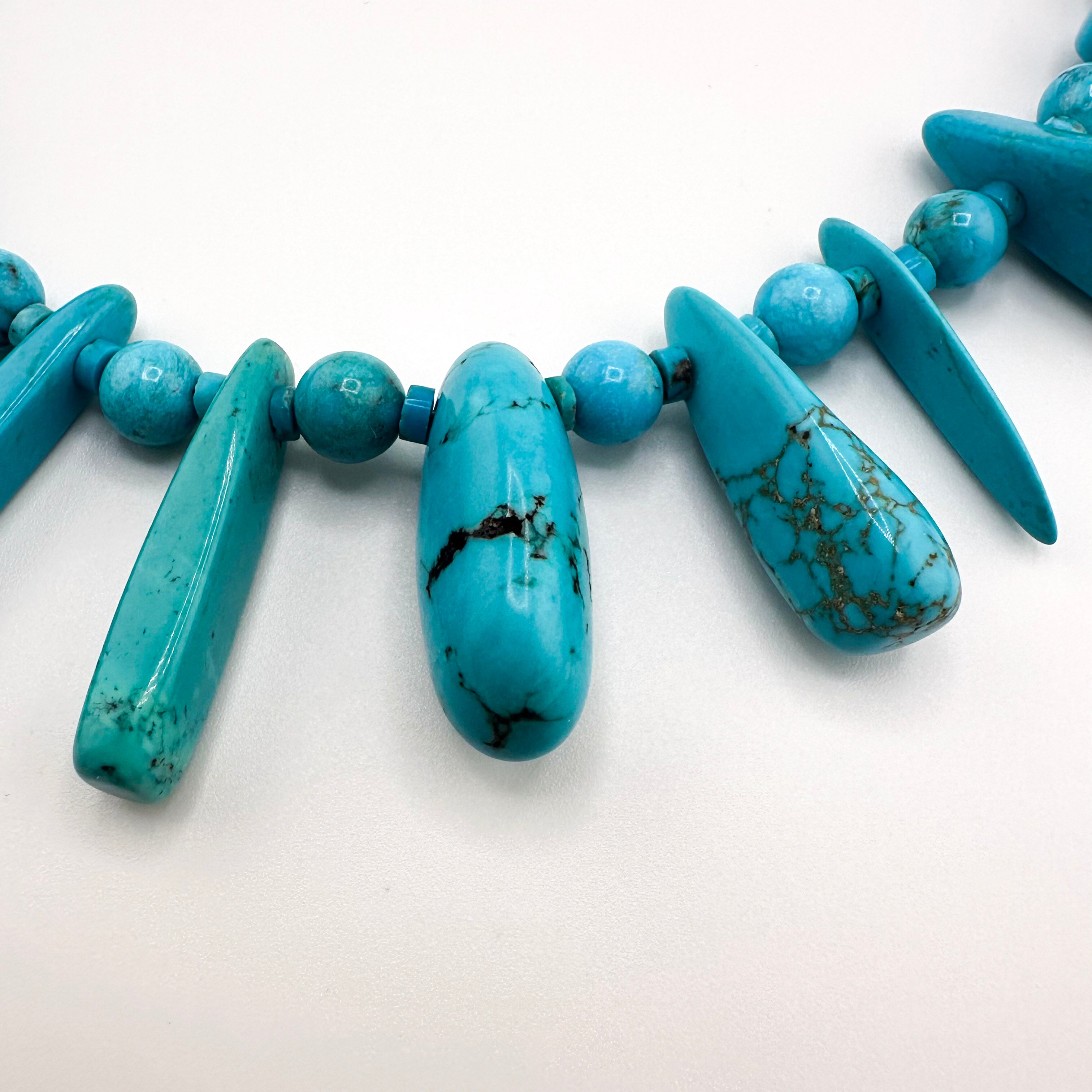 Turquoise and Sterling Silver Necklace close-up on white background
