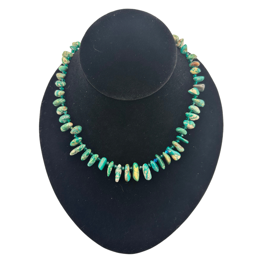 Turquoise, Swarovski Crystal, and Sterling Silver Necklace on black bust