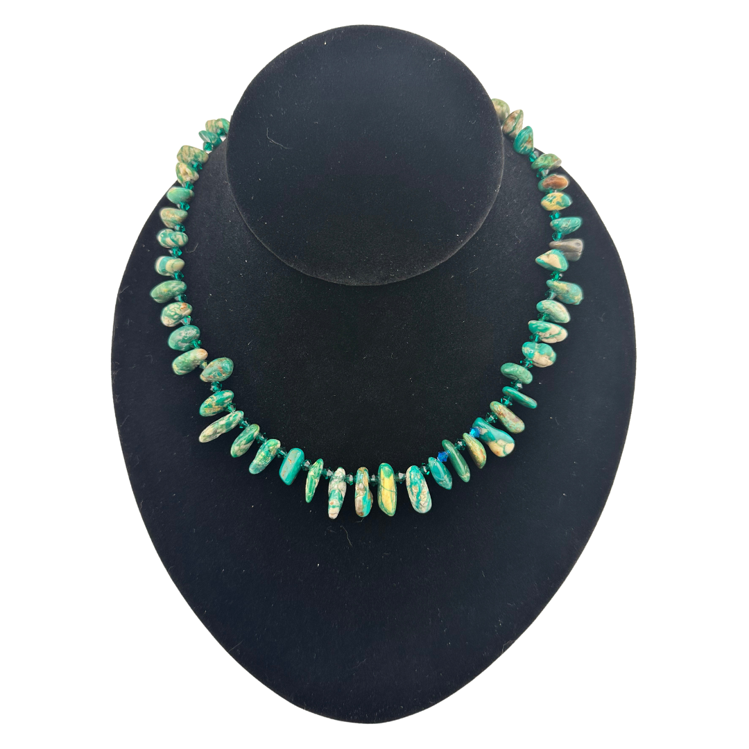 Turquoise, Swarovski Crystal, and Sterling Silver Necklace on black bust