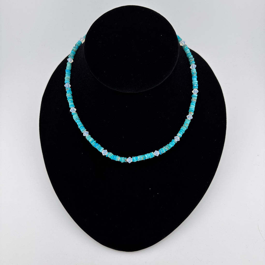 Turquoise, Swarovski Crystal, and Sterling Silver Necklace on black bust