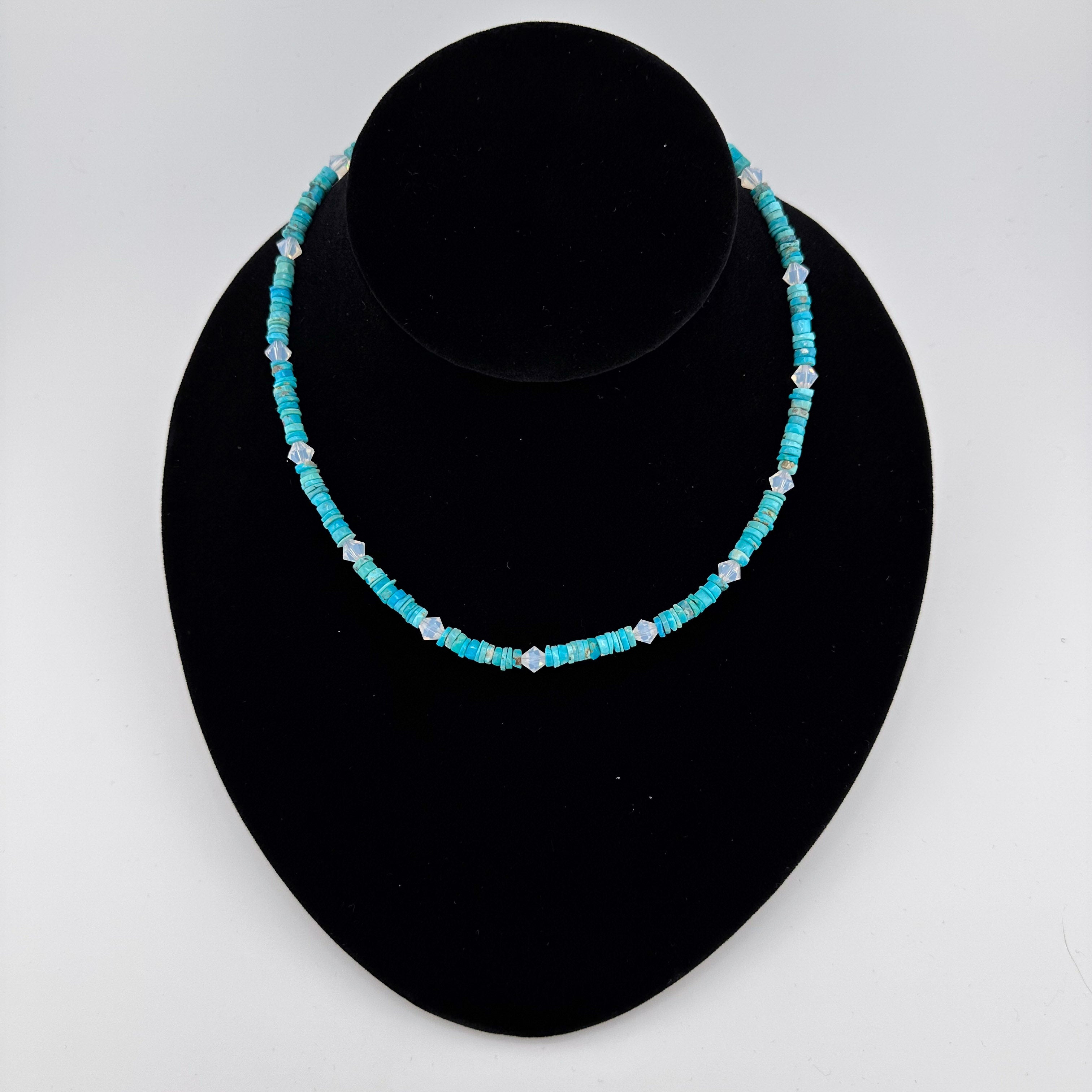 Turquoise, Swarovski Crystal, and Sterling Silver Necklace on black bust