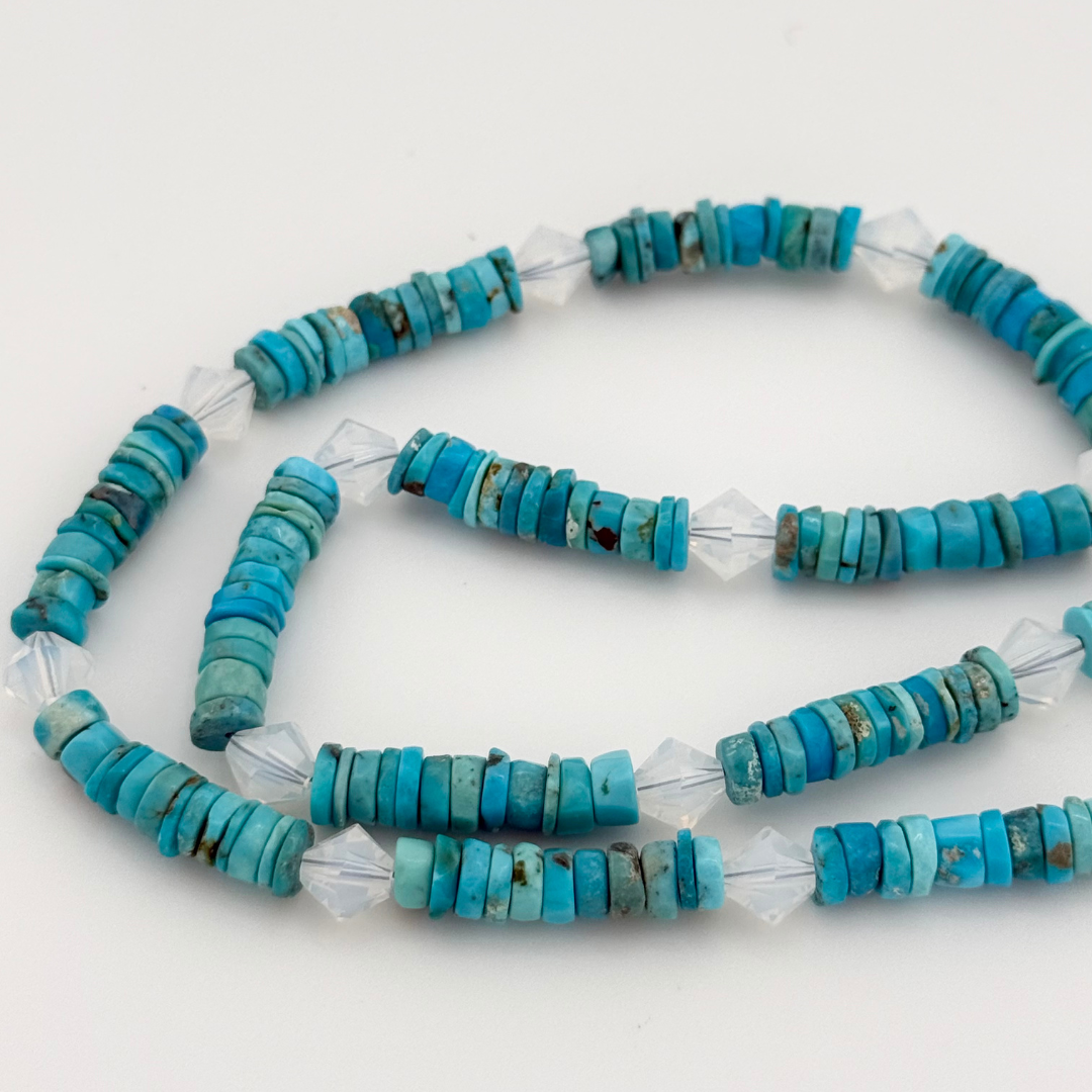 Turquoise, Swarovski Crystal, and Sterling Silver Necklace close-up on white background