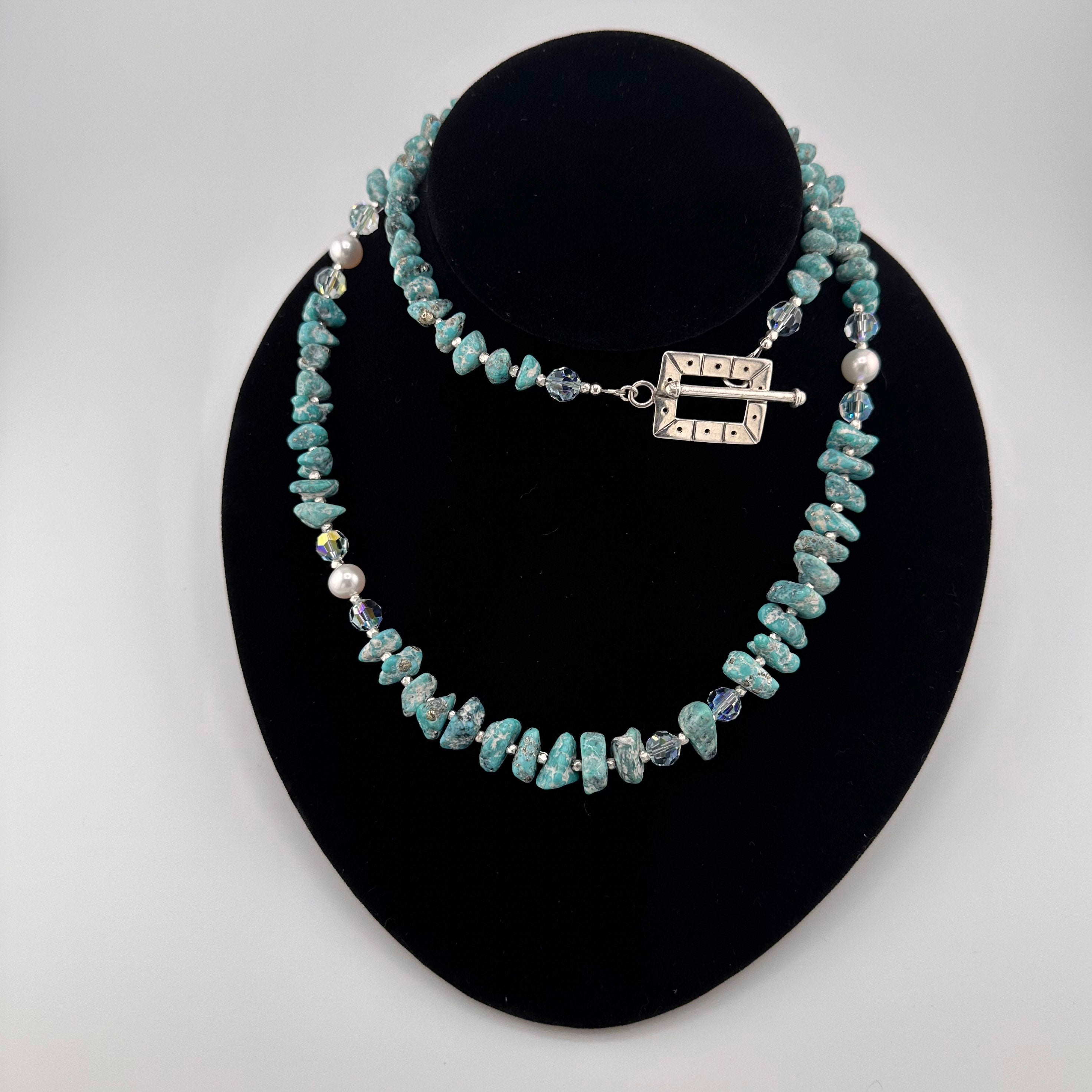 Turquoise, Pearl, Swarovski Crystal, and Sterling Silver Necklace on black bust