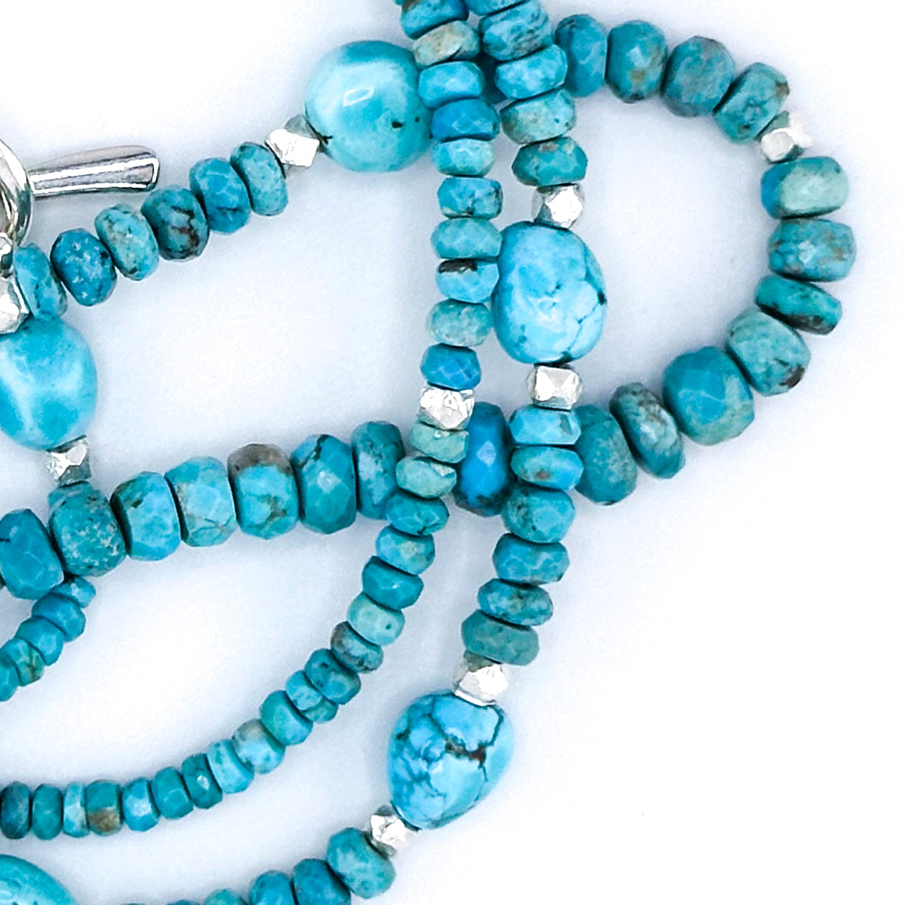 Turquoise and Sterling Silver Necklace close-up on white background