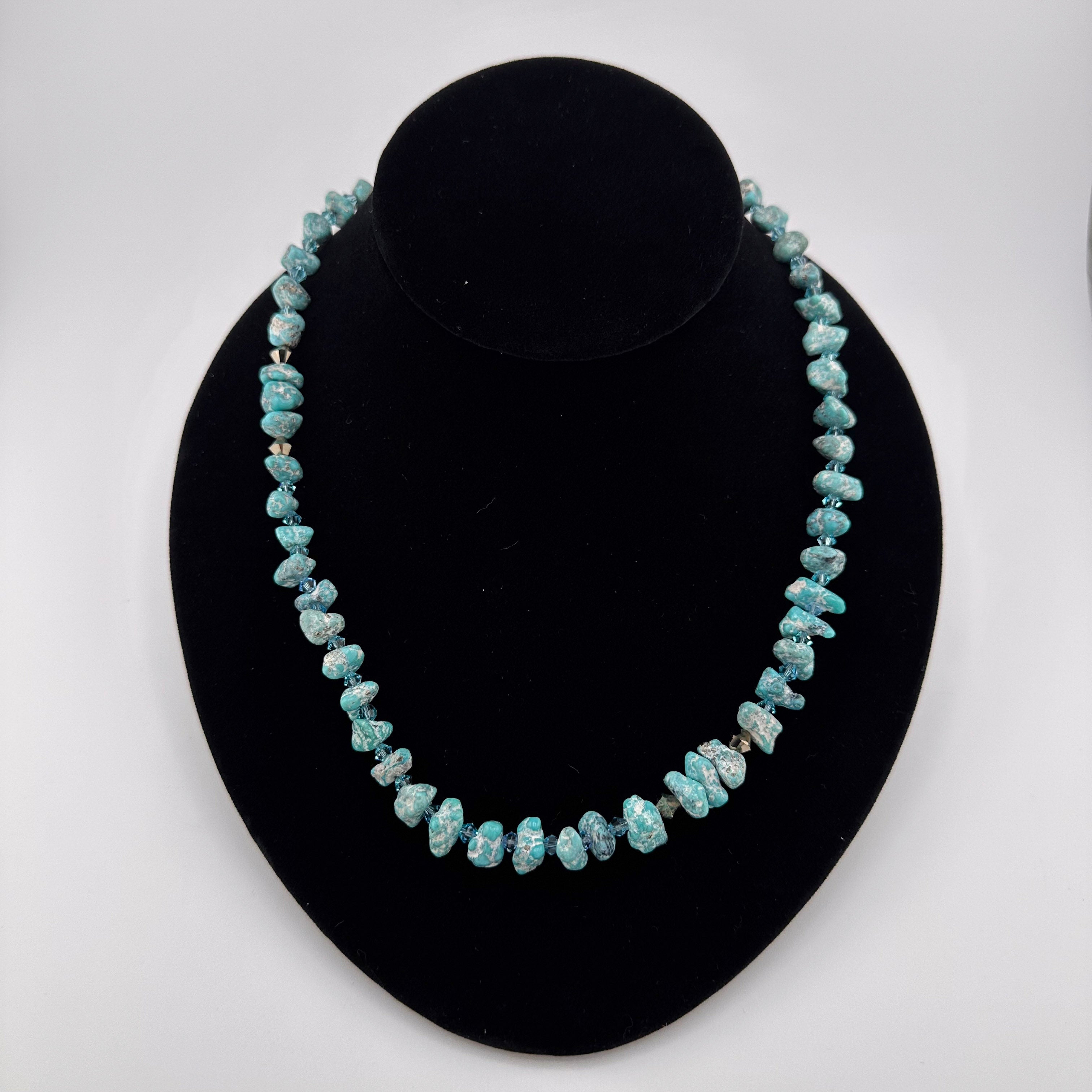 Turquoise, Swarovski Crystal, and Sterling Silver Necklace on black bust