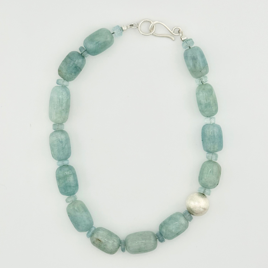 Aquamarine and Sterling Silver Necklace flatlay on white background