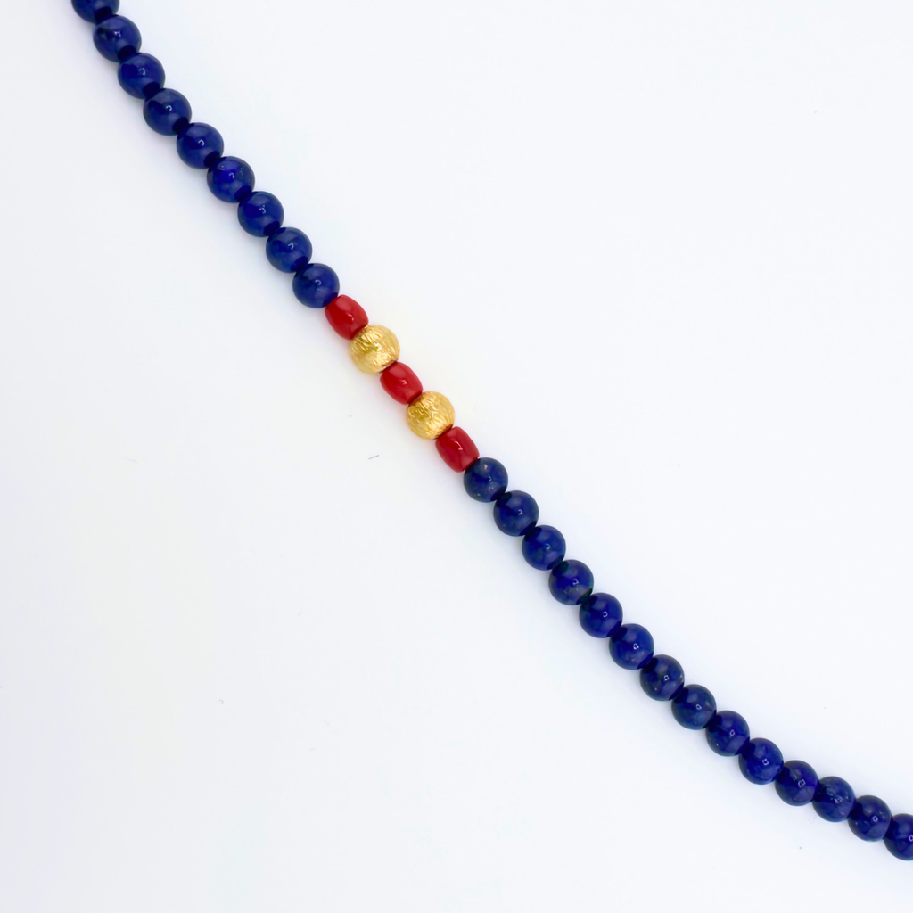 Lapis, Coral, and 22K Gold Vermeil Necklace closeup on white background