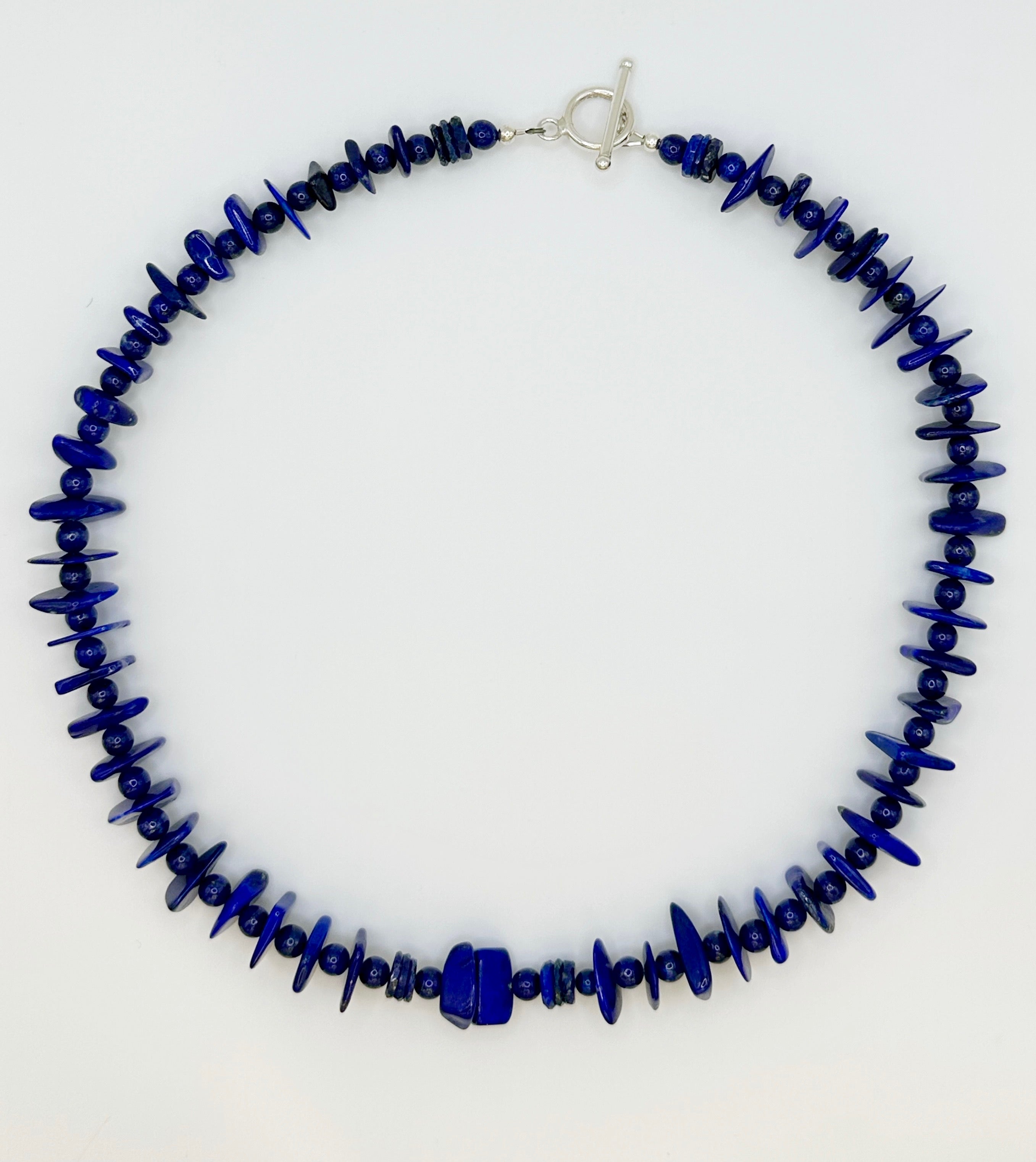 Lapis and Sterling Silver Necklace flatlay on white background