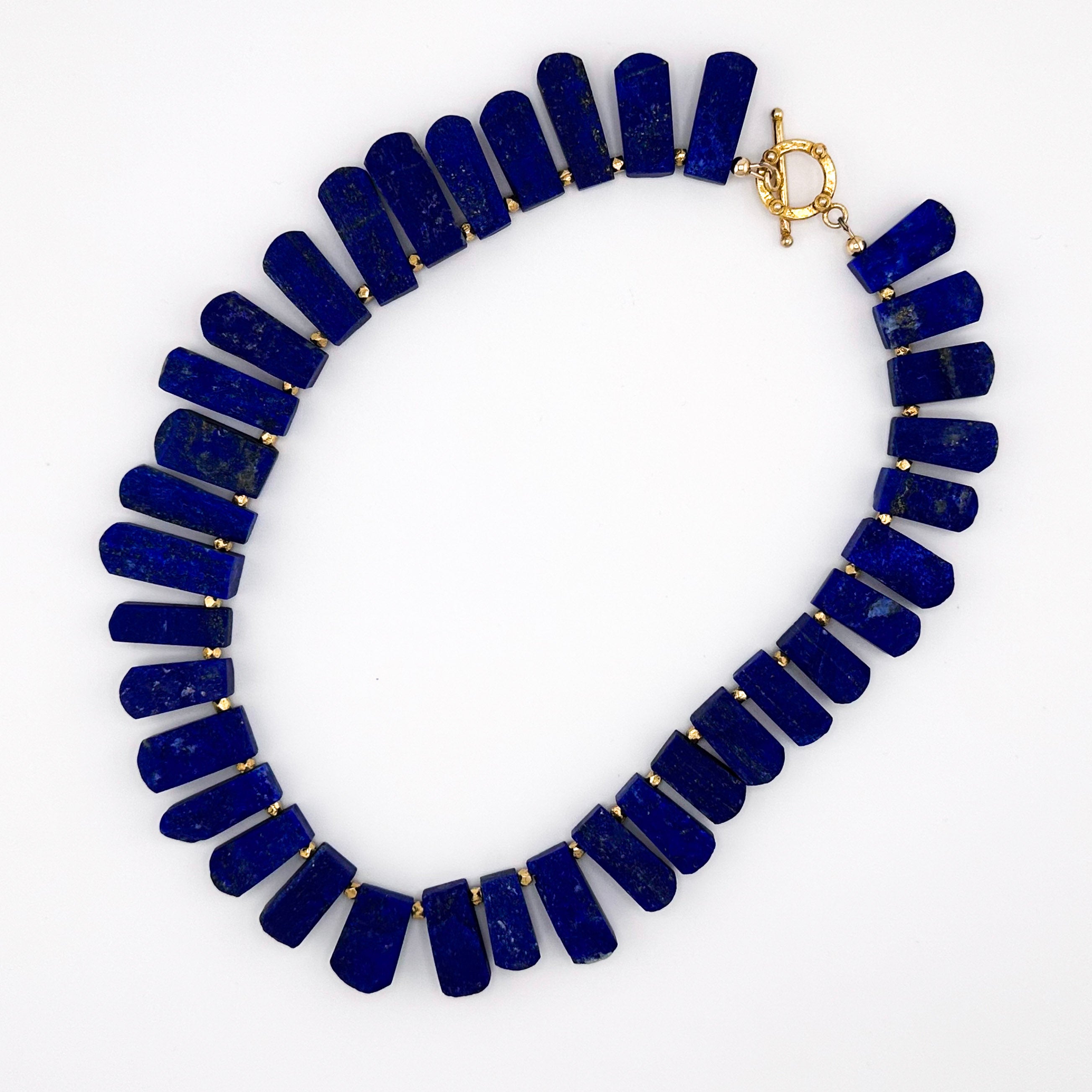 Lapis and 22K Gold Vermeil flatlay on white background