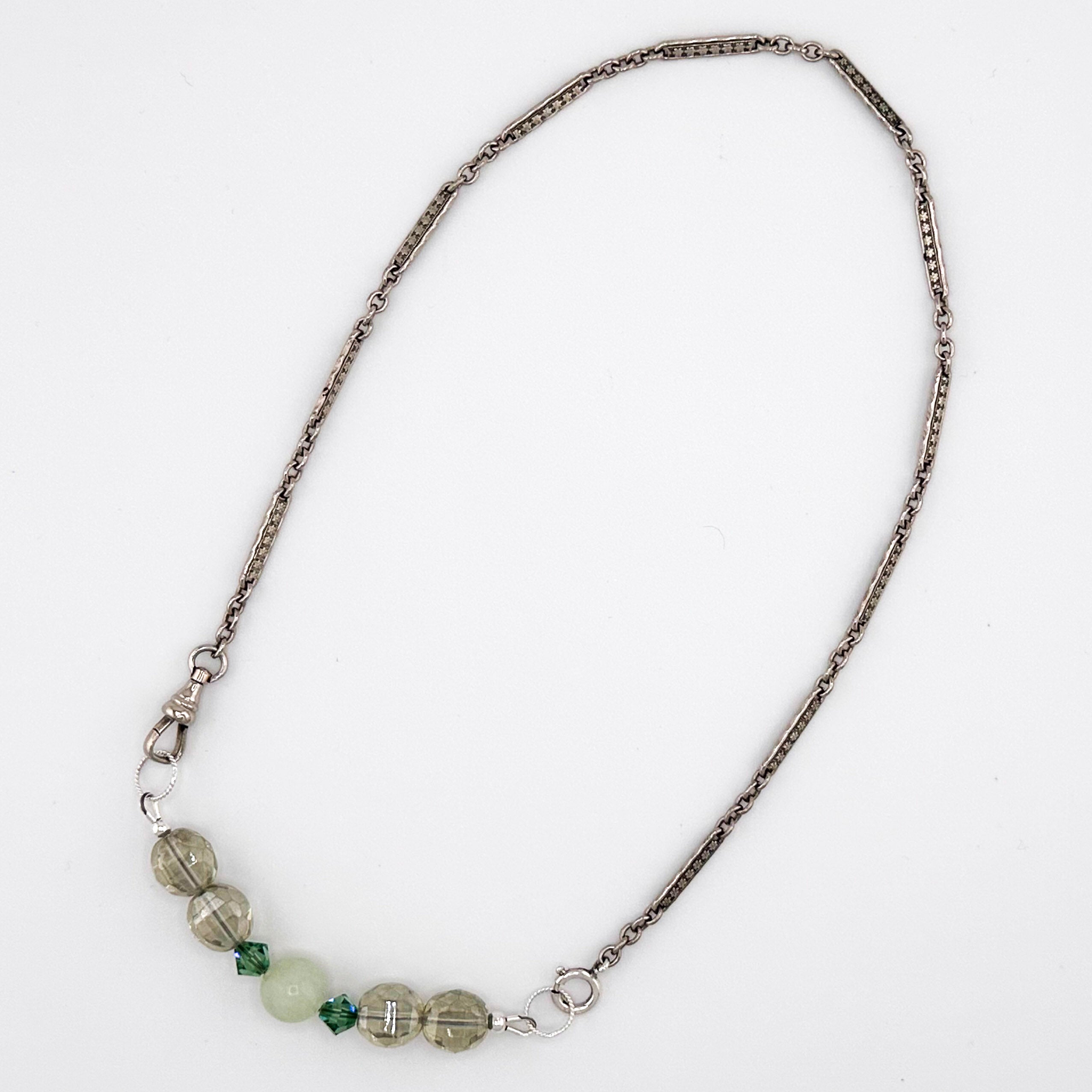 Sterling Silver Watch Chain, Jade, and Crystal Necklace flatlay on white background