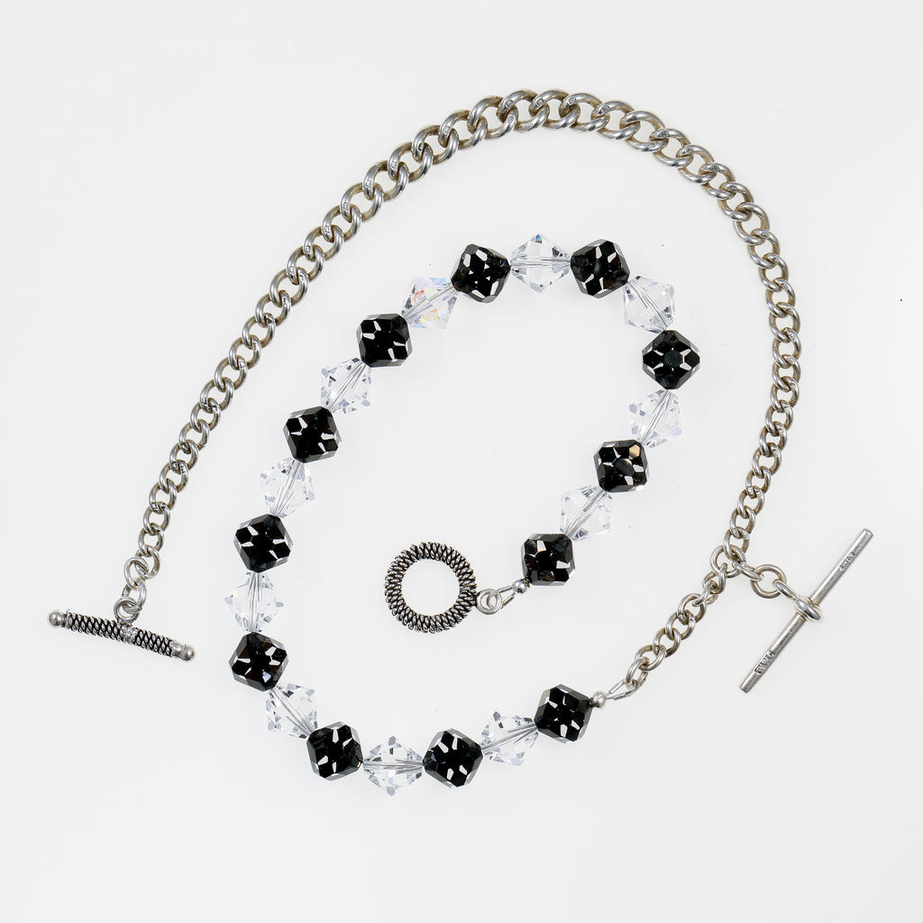 Sterling Silver Watch Chain and Swarovski Crystal Necklace flatlay on white background
