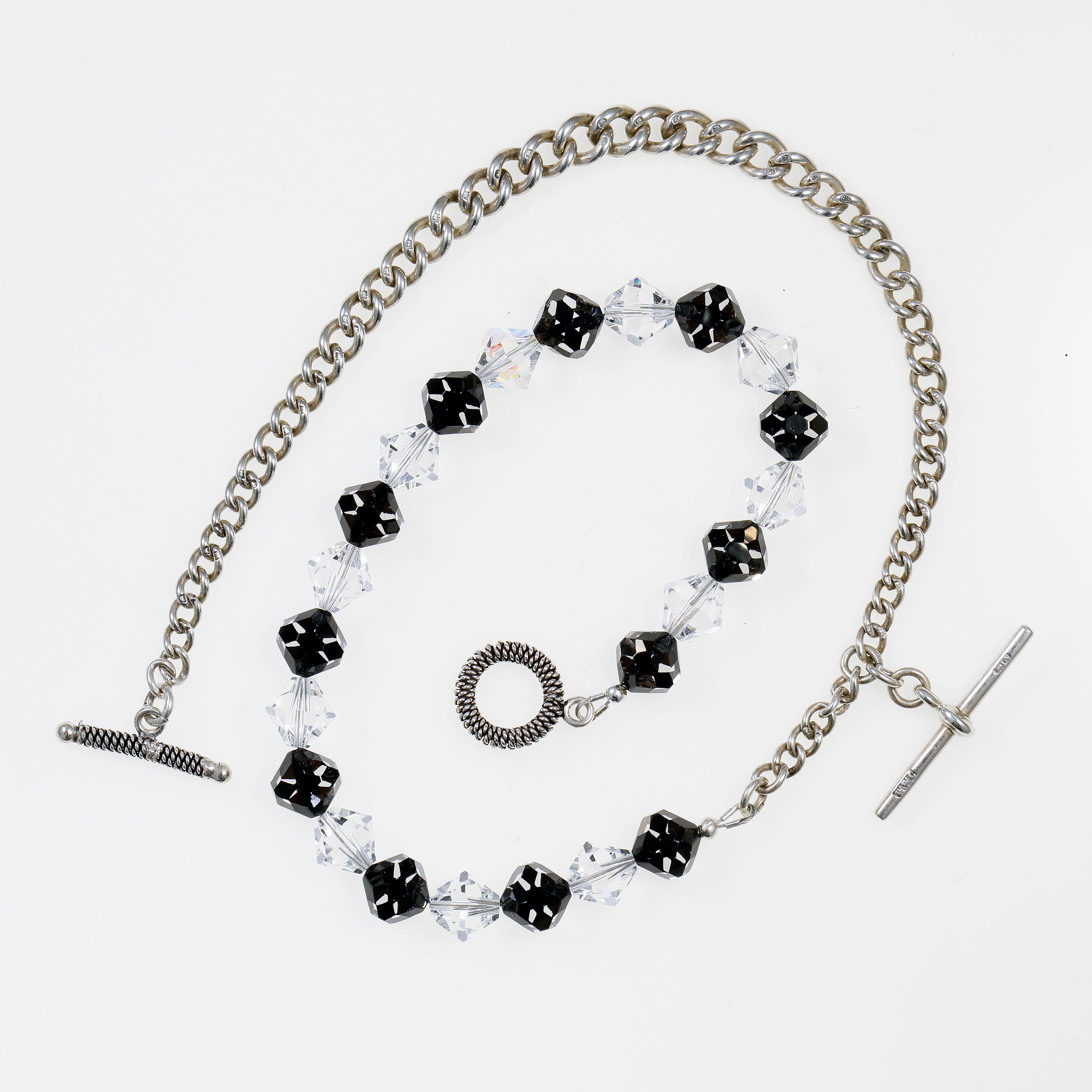 Sterling Silver Watch Chain and Swarovski Crystal Necklace flatlay on white background